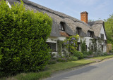 A Tour Of The Outside Of A Thatched Roof House