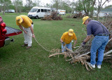 PULLING THE BIG PILES WITH THE TRUCK ELIMINATED HAVING TO STACK THE DEBRIS ONTO THE TRAILER