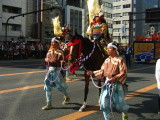 Samurai on horseback with attendants