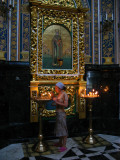 Lighting candles in the cathedral
