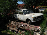 Precariously parked old car