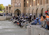 Esfahanis enjoying Khaju Bridge at sunset