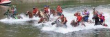 Brawn And Muscle As Horses And Men Ride Across River