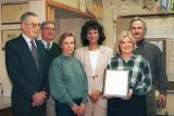 North Wales Councillors presenting certificate to teacher in her classroom.
