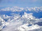 Above the clouds, leaving Milan, the Alps. What a sight!