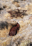Remnants of mining activity?: bed frame and a crushed tank