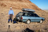 Desert bum at end of hike, with camera's remote control in his right hand
