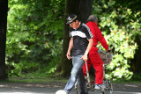Cross purposes. I think he was kicking a ball.