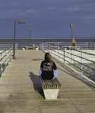 A mysterious lone figure at the end of the Harbor Beach pier.