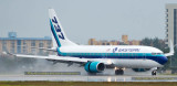 2016 - new Eastern Airlines B737-8CX N277EA landing on wet runway 27 aviation airline stock photo
