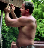 shirtless mechanic man working.jpg