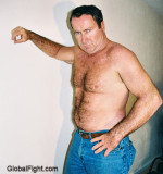 tuff man leaning on wall.jpg