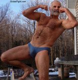 swim trunks dad flexing.JPG