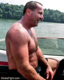 dad climbing into boat.jpg