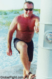 man rinsing off sand.jpg