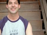 Sitting on the steps of Dao's grandmother's teak house: Chiangmai, Thailand