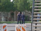 two officers looking east standing on Harris