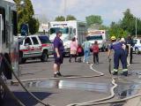78. lots of activity, lots of people, lots of vehicles