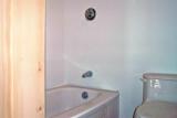The bathtub - it is white even if it looks beige