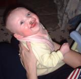 Burp your baby frequently!. This helps expel swallowed air while the baby is upright. Otherwise she may spit-up while lying down, possibly resulting in bacteria entering the middle ear.Hold your baby sitting up, in your lap, facing you. Support her chest with one hand, use the other hand to pat her back gently.