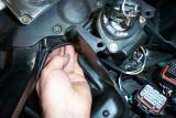 Route the wire up to the steering head in a way that the bars can still turn fully from lock to lock and the cable does not bind