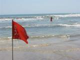 danger flag on the beach