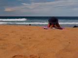 Woman in hat on beach