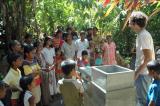 A community gathering is held to discuss correct use of UV Tube, safe water storage, and hygiene