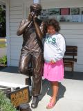 Sarah with harmonica player statue