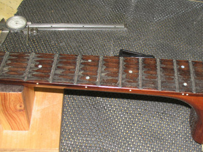 Looks like they went nuts with glue they used for the previous fret job