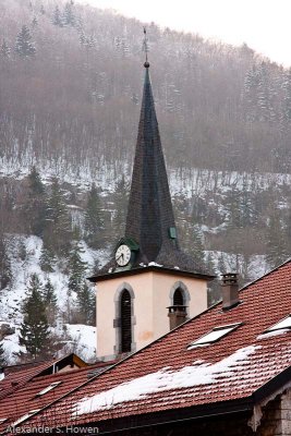 Church spire against the mountain