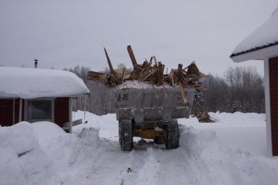 The loader moves the wood to the field