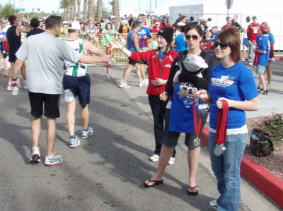 Handing out the finisher's medals