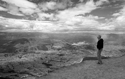 Dick Broach with view of Quito from mountains behind the city