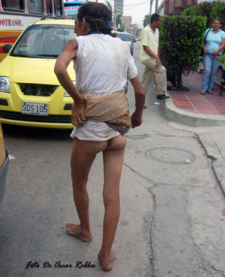 this woman walks her misery and  body  on the streets of Barranquilla