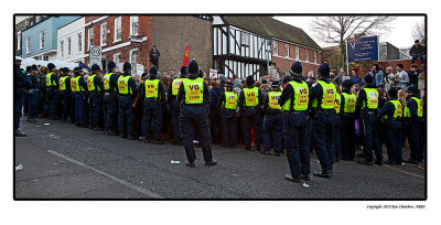 The Police gently but firmly move in.