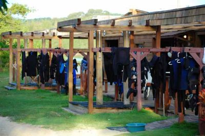 Wet suits hung out to remain wet