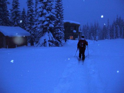 back to the lodge in falling snow at twilight