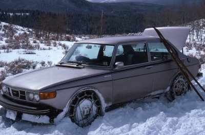 1976 SAAB 99 EMS with skinny wood skies and the front tires chained up