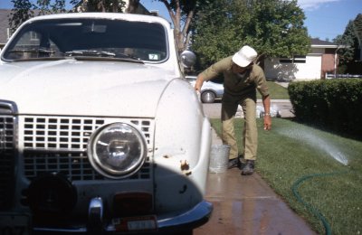 Dad washing Bob's SAAB 96