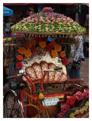 Colourful trishaws waiting for tourists