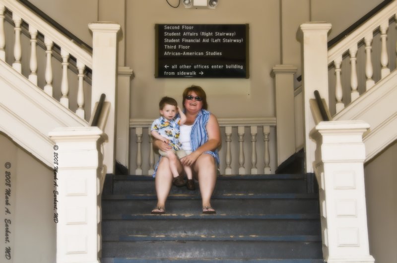 Eli and His Momma Sit on The Steps Of The Holms-Hunter Building