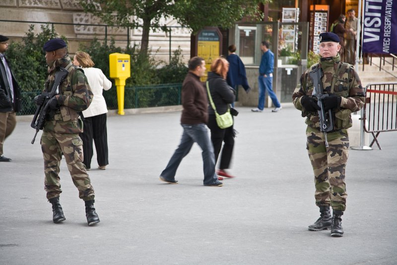 Children guarding the tower with machine guns