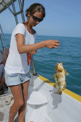 Juan's helper with a grouper