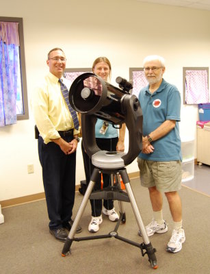 Local astronomers Bill Shaheen and Bill Dellinges set-up the school's first telescope on Sep. 15, 2009. Pictured along with the Celestron CPC1100 are, L-R, Larry Laprise, PTES Principal; Julia Goucher, PTES Science Teacher; and Bill Dellinges, local astronomer. The telescope will be installed in the Peralta Trail Astronomical Observatory being planned for the Fall of 2009.

