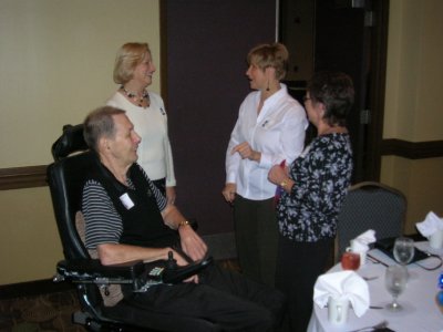 Neal and Elaine Butler chatting with Helen Petrack McKenzie and Stella Bouris Sylvester