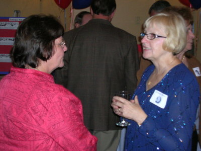 Marlene Dumrauf Dickson (l) chatting with Roseann Brown