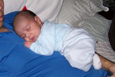 Henry finds a comfortable position on Daddy's chest