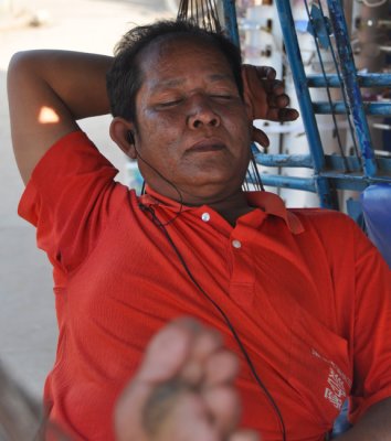 Lao cycle cabbie resting