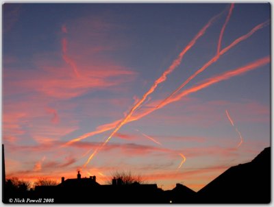 Contrails and chimney stacks